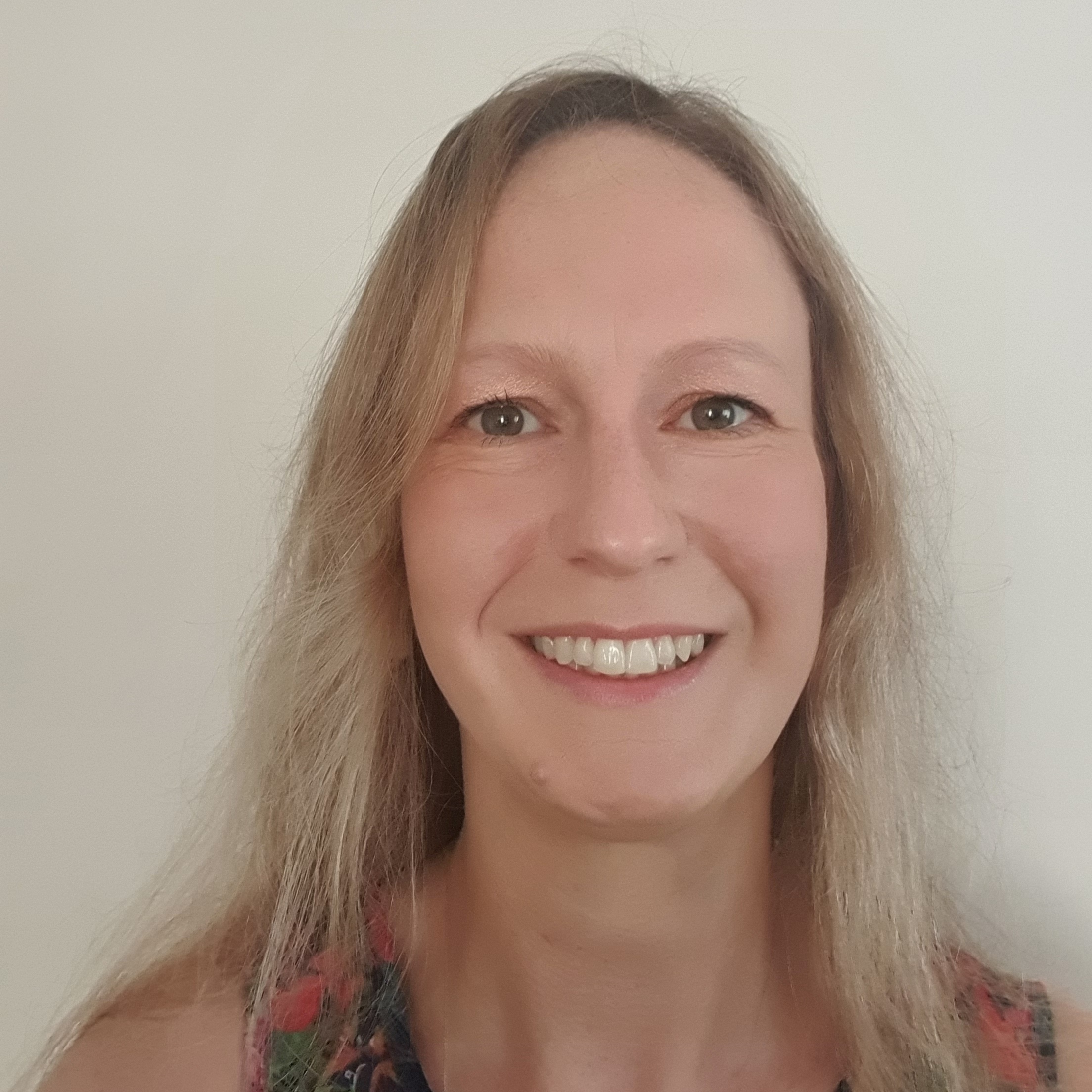 Headshot of Kylie, who is smiling.